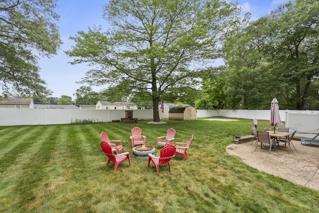 15 Arlington Rd, Windsor Locks, CT 06096 - fenced backyard with a fire pit, a shed, and a patio