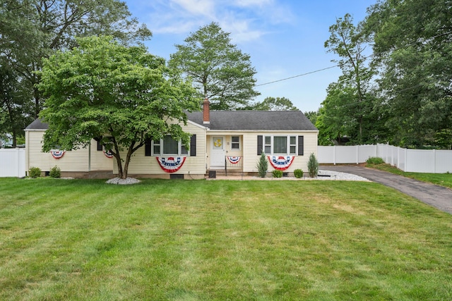 15 Arlington Rd, Windsor Locks, CT 06096 - view of front of home featuring a chimney and asphalt driveway
