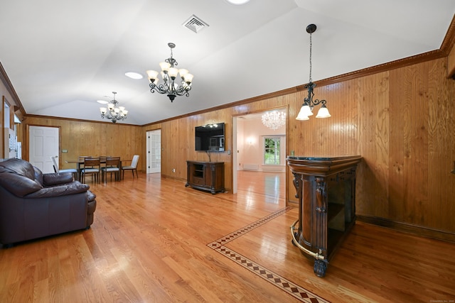 9 Old Logging Rd, Stamford, CT 06903 - living room featuring vaulted ceiling, a chandelier, wooden walls, and light wood-style flooring