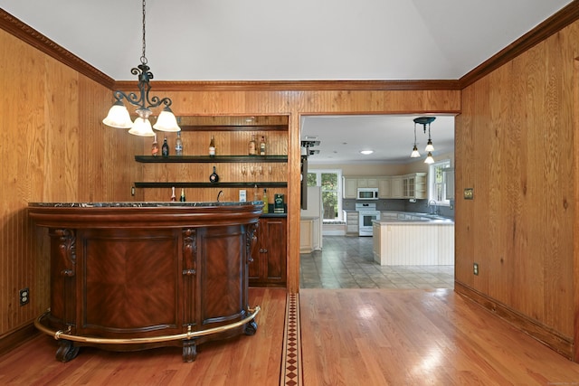 9 Old Logging Rd, Stamford, CT 06903 - indoor bar with wood walls, wood finished floors, white electric stove, pendant lighting, and stainless steel microwave
