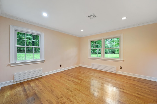 9 Old Logging Rd, Stamford, CT 06903 - spare room with radiator heating unit, wood finished floors, recessed lighting, and ornamental molding
