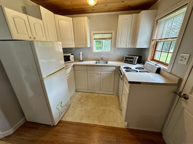 37 Lane St, Shelton, CT 06484 - kitchen featuring wooden ceiling, white appliances, healthy amount of natural light, light wood-style floors, and white cabinetry