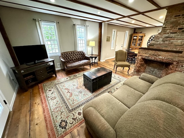 37 Lane St, Shelton, CT 06484 - living area featuring recessed lighting, wood finished floors, a large fireplace, and beamed ceiling