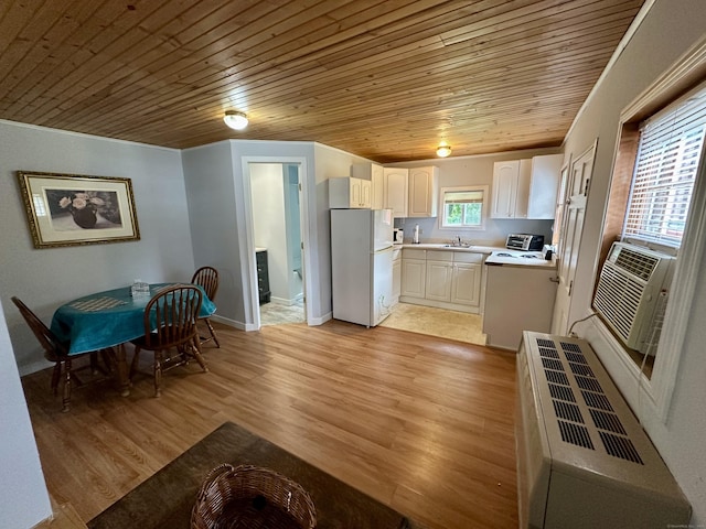 37 Lane St, Shelton, CT 06484 - kitchen with wood ceiling, freestanding refrigerator, light countertops, light wood finished floors, and white cabinetry