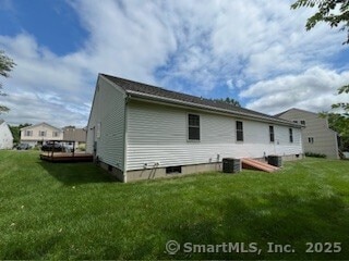 1929 Logans Way, Windsor, CT 06095 - rear view of house with a lawn