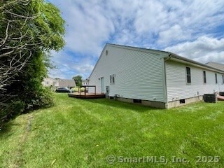 1929 Logans Way, Windsor, CT 06095 - view of side of home featuring a deck and a lawn