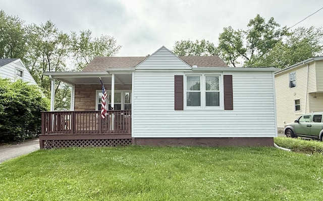 17 Ohear Ave, Enfield, CT 06082 - view of front facade featuring covered porch, a front yard, and a shingled roof