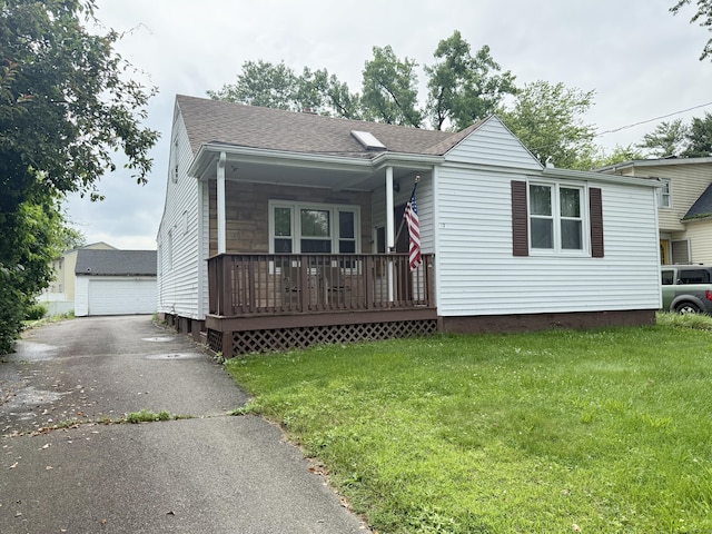 17 Ohear Ave, Enfield, CT 06082 - ranch-style house featuring a porch, a front lawn, a shingled roof, a detached garage, and an outdoor structure