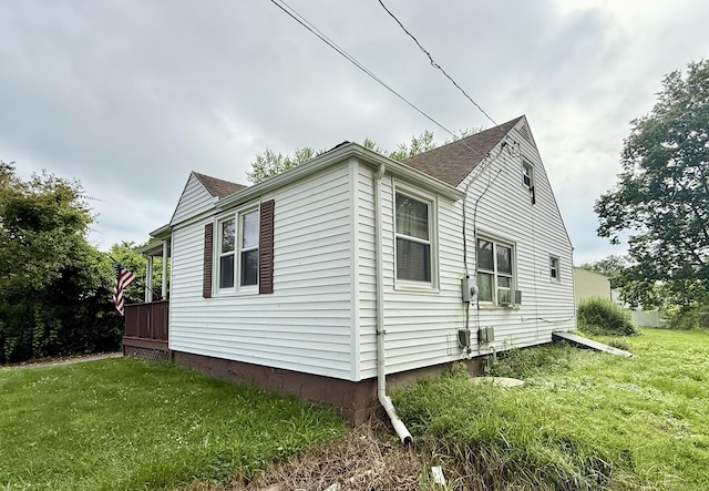 17 Ohear Ave, Enfield, CT 06082 - view of property exterior featuring a lawn, cooling unit, and roof with shingles