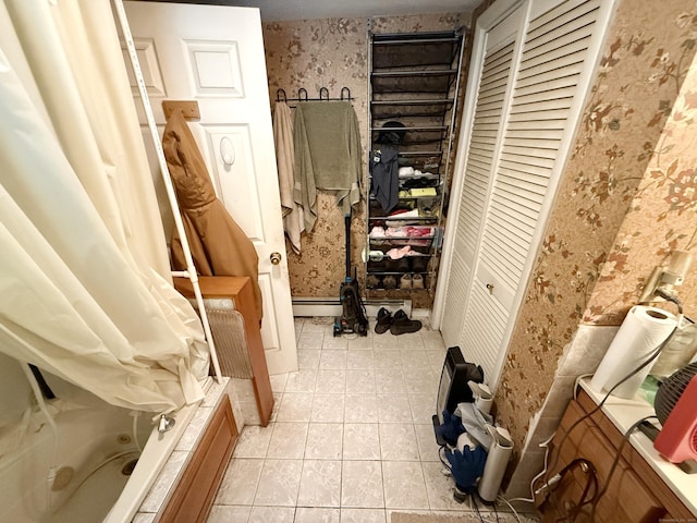 17 Ohear Ave, Enfield, CT 06082 - full bath featuring wallpapered walls, tile patterned flooring, a closet, and a combined bath / shower with jetted tub