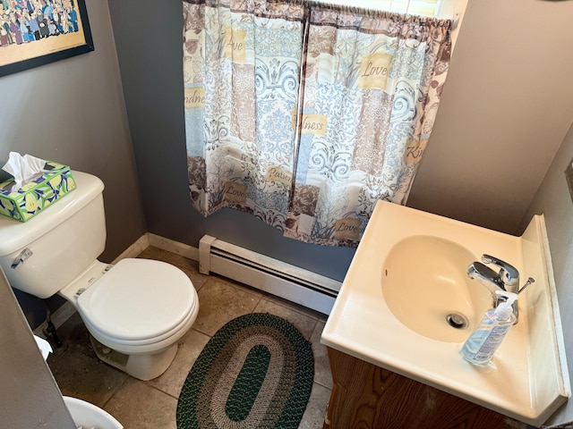 17 Ohear Ave, Enfield, CT 06082 - bathroom with a baseboard radiator, vanity, and tile patterned flooring