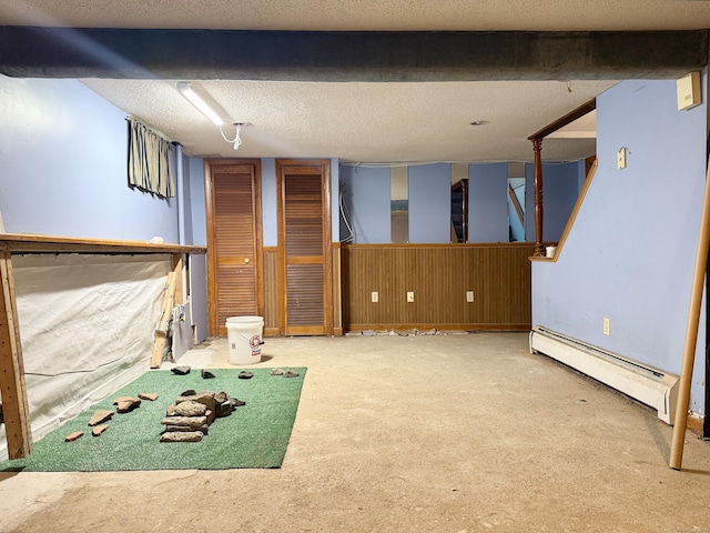 17 Ohear Ave, Enfield, CT 06082 - finished below grade area featuring a baseboard radiator, carpet, and a textured ceiling