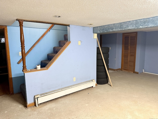 17 Ohear Ave, Enfield, CT 06082 - finished below grade area with baseboard heating, stairs, and a textured ceiling