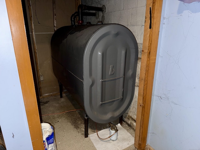 17 Ohear Ave, Enfield, CT 06082 - basement view of oil tank and concrete flooring