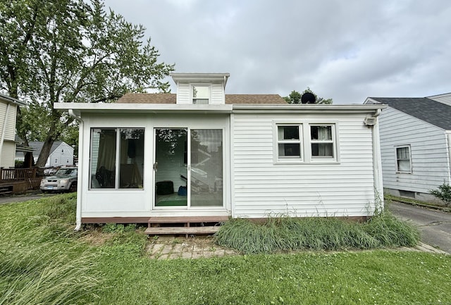 17 Ohear Ave, Enfield, CT 06082 - back of house featuring roof with shingles and a sunroom