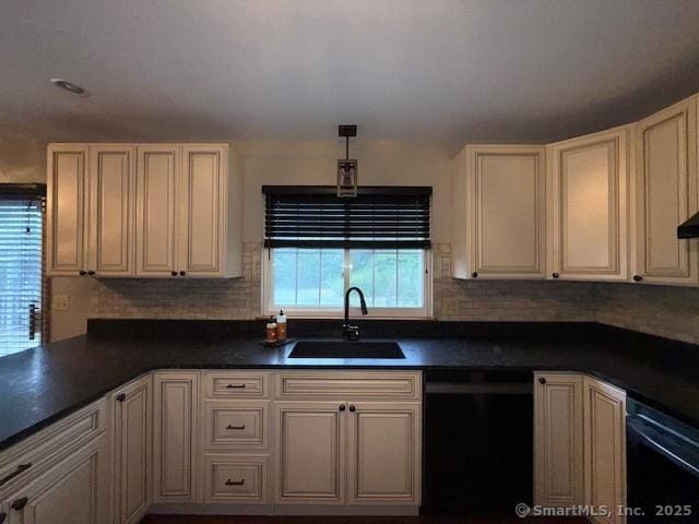67 Bergendahl Dr, Griswold, CT 06351 - kitchen featuring dishwasher, dark countertops, and tasteful backsplash