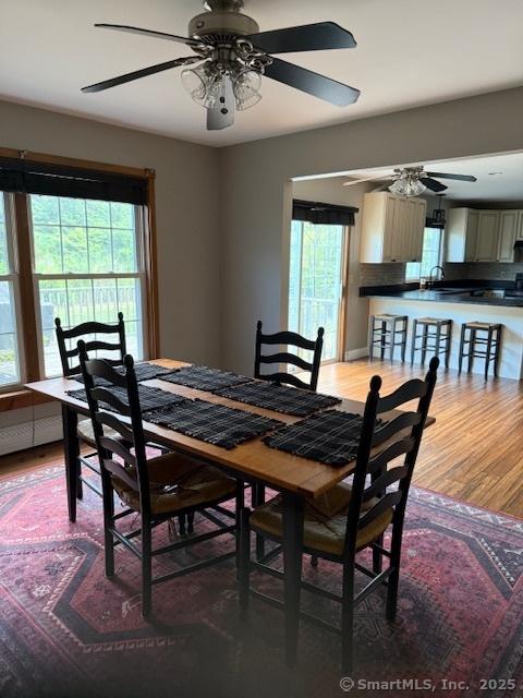 67 Bergendahl Dr, Griswold, CT 06351 - dining space with a ceiling fan, plenty of natural light, and wood finished floors