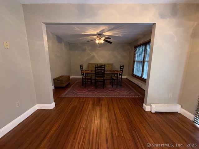 67 Bergendahl Dr, Griswold, CT 06351 - dining area featuring a ceiling fan, wood finished floors, and baseboard heating