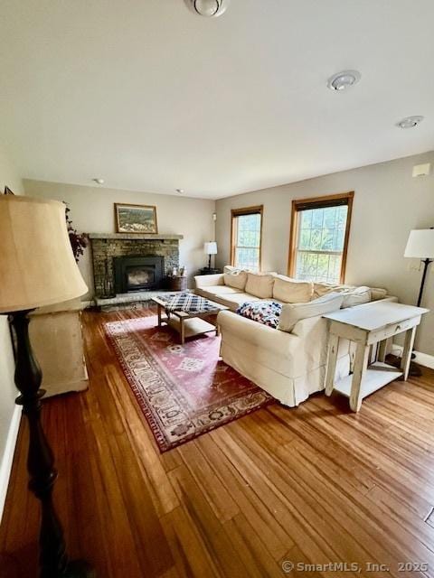 67 Bergendahl Dr, Griswold, CT 06351 - living area featuring wood finished floors and a stone fireplace