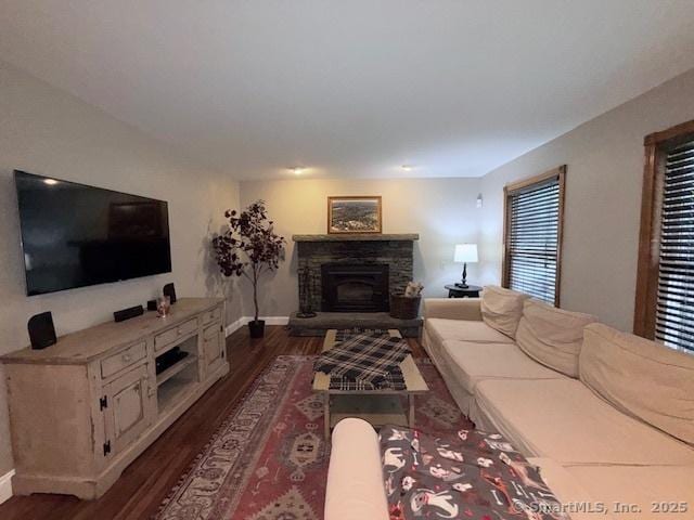 67 Bergendahl Dr, Griswold, CT 06351 - living area featuring a stone fireplace and dark wood-style flooring