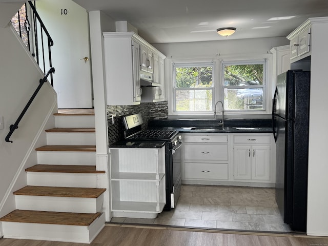 10 Willowbrook Ct Unit 10, Stamford, CT 06902 - kitchen featuring black appliances, dark countertops, white cabinets, tasteful backsplash, and under cabinet range hood