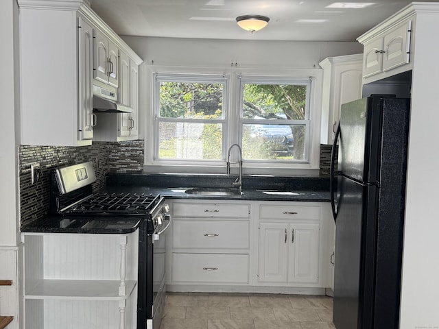 10 Willowbrook Ct Unit 10, Stamford, CT 06902 - kitchen with gas stove, freestanding refrigerator, white cabinets, under cabinet range hood, and tasteful backsplash
