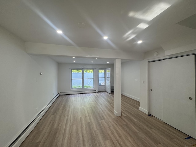 10 Willowbrook Ct Unit 10, Stamford, CT 06902 - unfurnished living room with baseboard heating, wood finished floors, recessed lighting, and a baseboard radiator