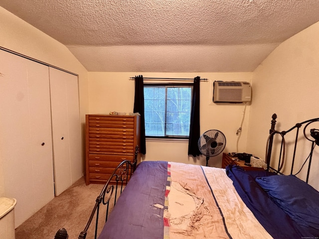 92 Cynthia Ln Apt E1, Middletown, CT 06457 - carpeted bedroom with lofted ceiling, a textured ceiling, a closet, and a wall unit AC