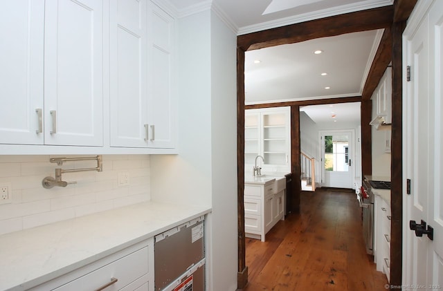 65 Water St, Guilford, CT 06437 - kitchen featuring crown molding, backsplash, wood finished floors, white cabinets, and stainless steel range