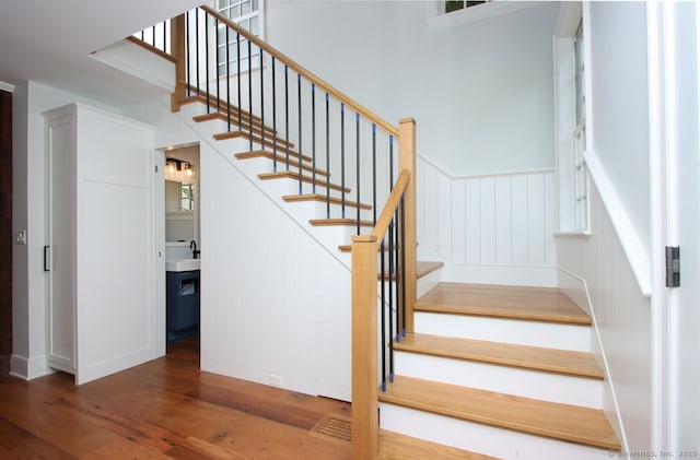 65 Water St, Guilford, CT 06437 - stairs featuring wood finished floors and a decorative wall