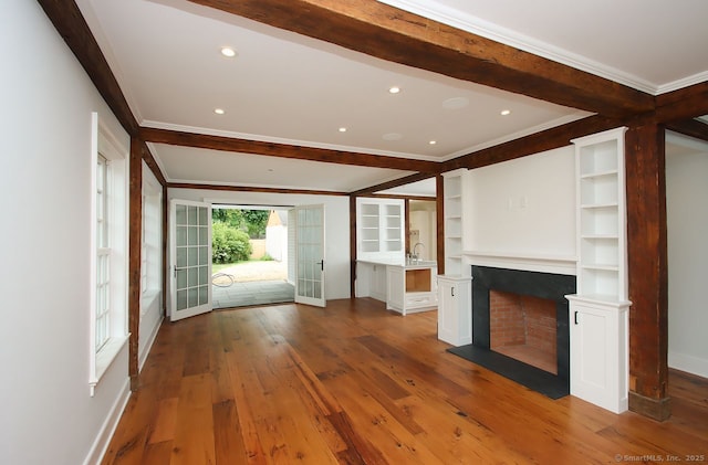 65 Water St, Guilford, CT 06437 - unfurnished living room featuring crown molding, beamed ceiling, a fireplace, wood finished floors, and recessed lighting