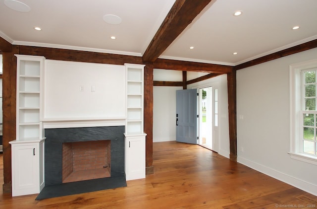 65 Water St, Guilford, CT 06437 - unfurnished living room featuring a fireplace, ornamental molding, wood finished floors, beamed ceiling, and recessed lighting