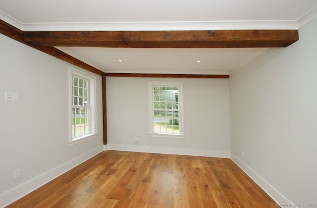 65 Water St, Guilford, CT 06437 - empty room with healthy amount of natural light, beam ceiling, light wood-type flooring, and ornamental molding