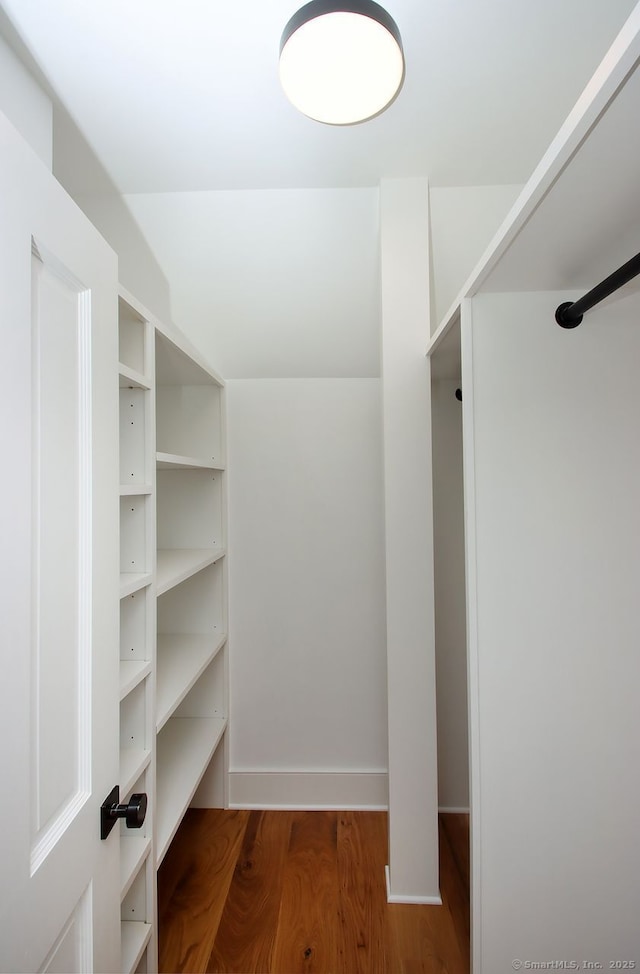 65 Water St, Guilford, CT 06437 - walk in closet with wood finished floors