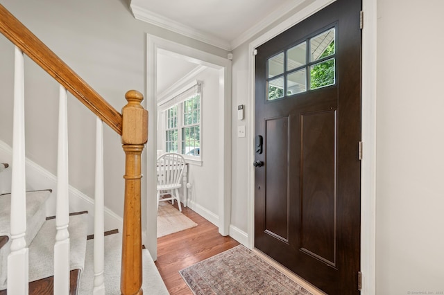 73 Water St, Glastonbury, CT 06073 - entrance foyer featuring wood finished floors, stairway, and ornamental molding