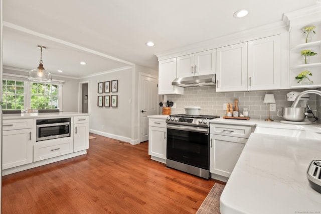 73 Water St, Glastonbury, CT 06073 - kitchen featuring appliances with stainless steel finishes, open shelves, crown molding, backsplash, and white cabinets