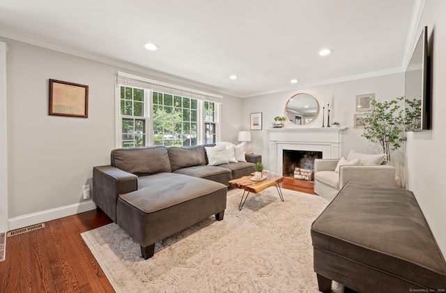 73 Water St, Glastonbury, CT 06073 - living area featuring ornamental molding, wood finished floors, a fireplace, and recessed lighting