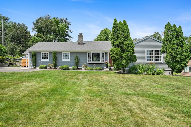 68 William St, Norwalk, CT 06851 - ranch-style home featuring a chimney and a front yard
