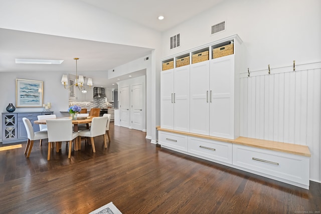 68 William St, Norwalk, CT 06851 - dining area with a chandelier, dark wood-style floors, and recessed lighting