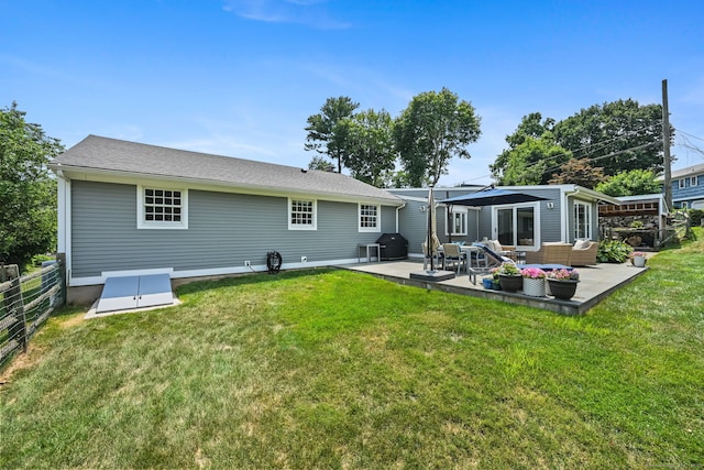 68 William St, Norwalk, CT 06851 - back of property with outdoor lounge area, a patio, and roof with shingles