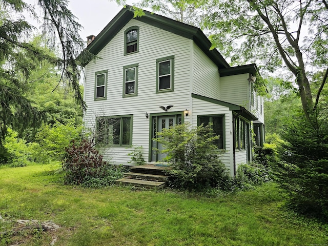 16AND23 Farrell Rd, Newtown, CT 06470 - rear view of property featuring a lawn