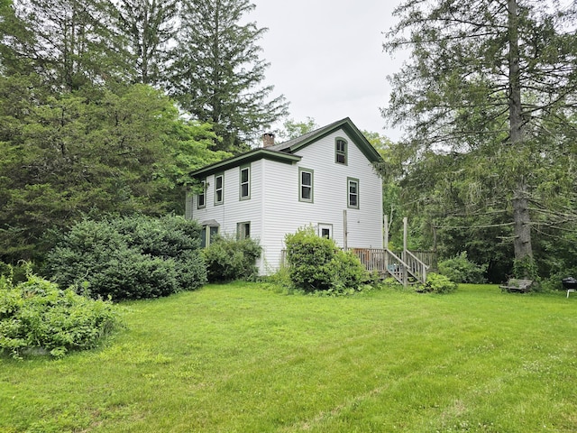 16AND23 Farrell Rd, Newtown, CT 06470 - view of property exterior featuring a chimney and a lawn