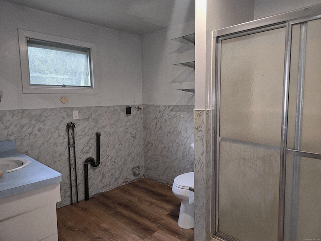 16AND23 Farrell Rd, Newtown, CT 06470 - full bath featuring wood finished floors, tile walls, a stall shower, vanity, and wainscoting