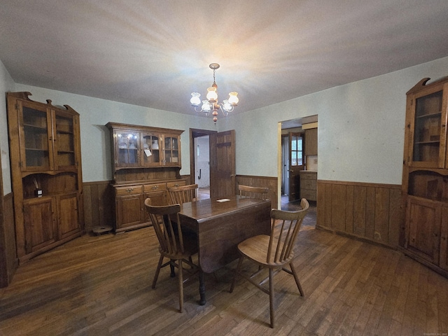 16AND23 Farrell Rd, Newtown, CT 06470 - dining room with wainscoting, dark wood-style flooring, a chandelier, and wooden walls