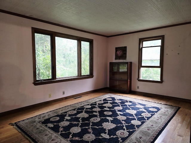 16AND23 Farrell Rd, Newtown, CT 06470 - unfurnished room with wood-type flooring, crown molding, and an ornate ceiling