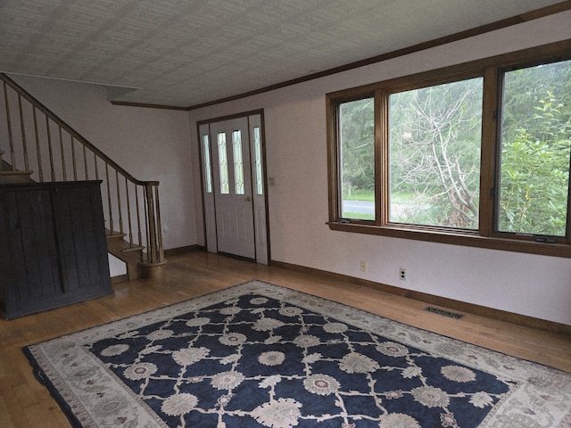 16AND23 Farrell Rd, Newtown, CT 06470 - entrance foyer featuring wood finished floors, stairs, and crown molding