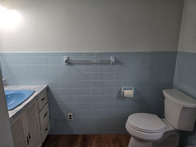 16AND23 Farrell Rd, Newtown, CT 06470 - half bath featuring tile walls, vanity, wood finished floors, and a wainscoted wall
