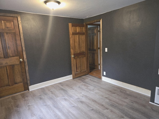 16AND23 Farrell Rd, Newtown, CT 06470 - empty room with wood finished floors and baseboards