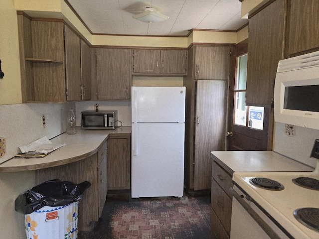 16AND23 Farrell Rd, Newtown, CT 06470 - kitchen with white appliances, light countertops, ceiling fan, and brick patterned floors