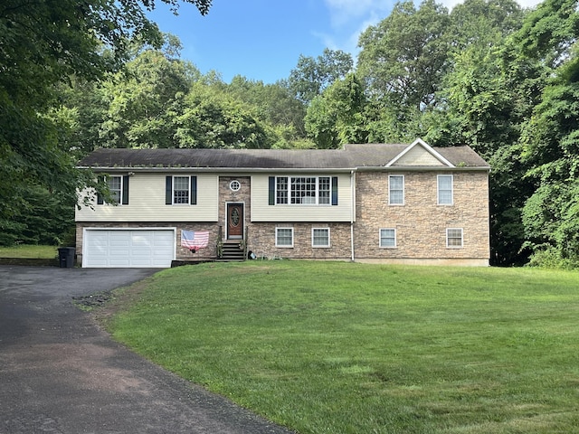 300 Foxon Hill Rd, East Haven, CT 06513 - split foyer home featuring driveway, a garage, entry steps, and a front yard